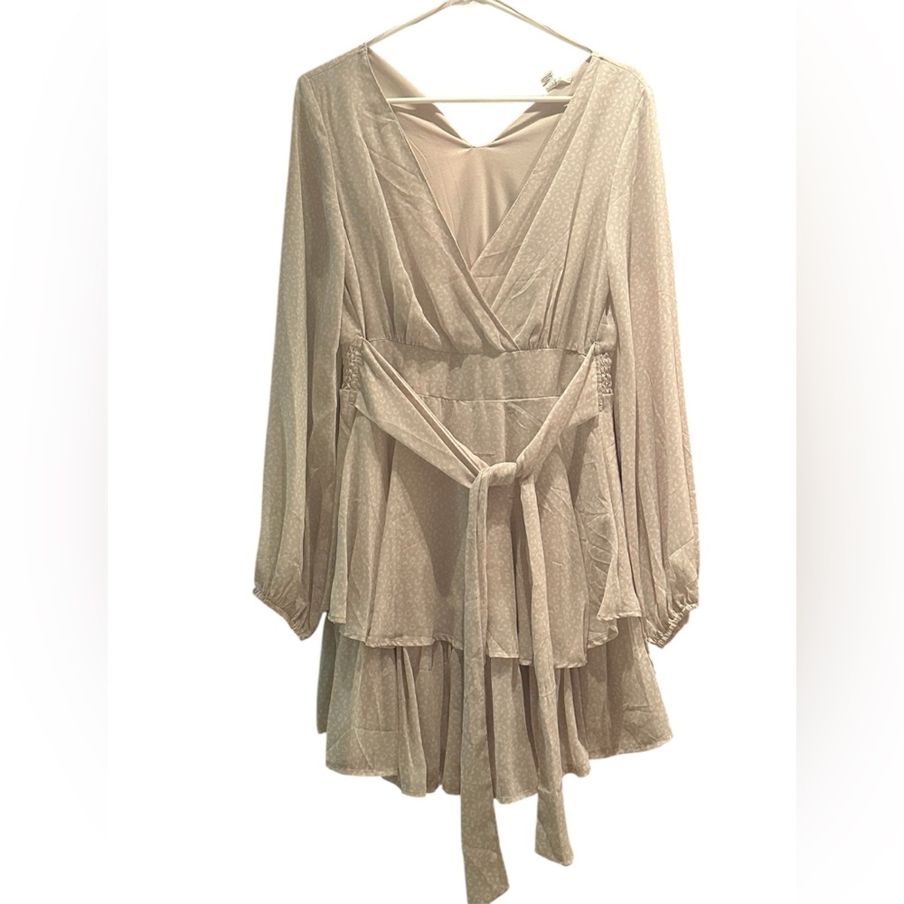 short long-sleeve dress made of light fabric in white and cream, you could
